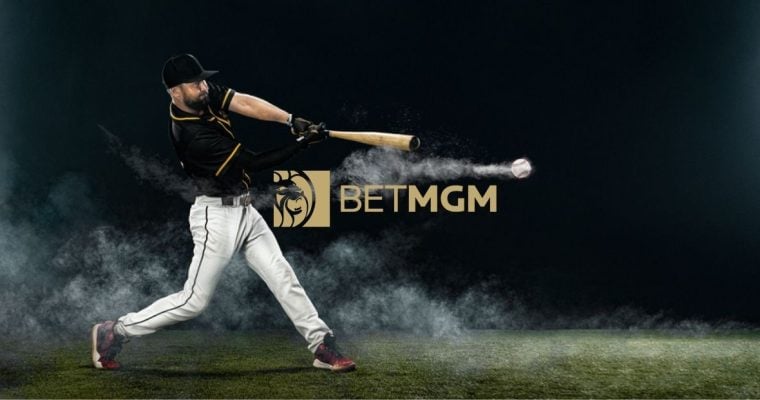 BetMGM Logo Sits Beneath Swinging Baseball Player Hitting Baseball on Field