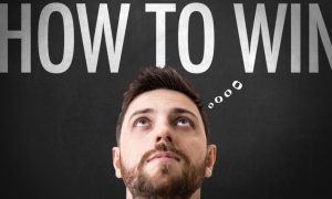 "How To Win" Phrase As Thought Bubble Above Man's Head Looking Up