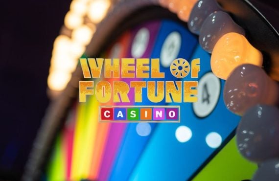 Wheel of Fortune Casino Logo Over Colorful Arcade Style Gambling Wheel