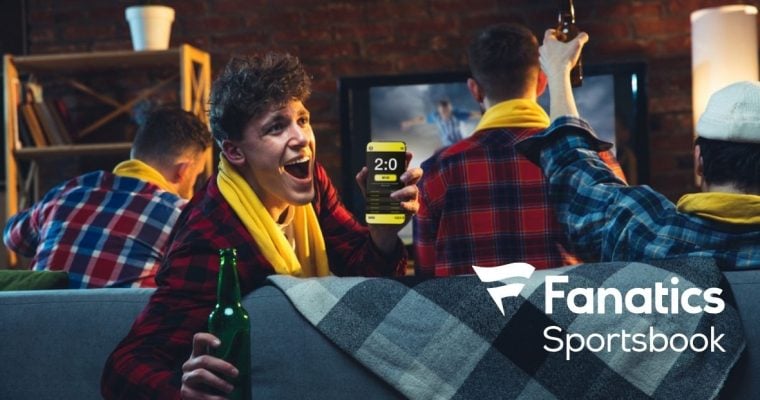 Emotional Man With Phone Cheering for Favourite Team, Celebrating Successful Betting