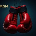 BetMGM Logo Over Image of A Pair of Hanging Red Boxing Gloves