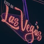 Brightly Lit City of Las Vegas Marquee Against Night Sky