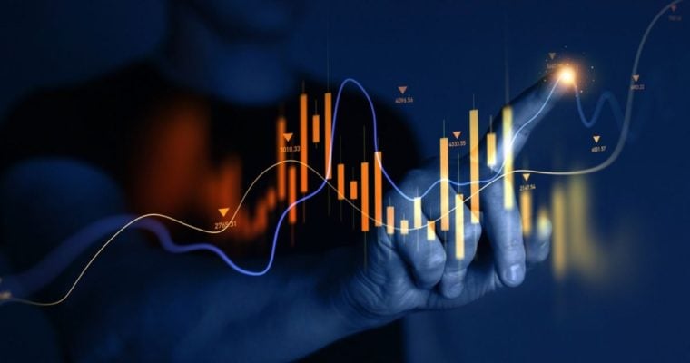 Man Points to A Section of A Digital Graph that Rises and Falls