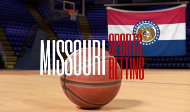 Missouri Flag Hangs Inside Empty Basketball Court with Basketball on Floor and Missouri Sports Betting Text