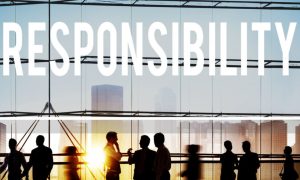 Word "Responsibility" Sits Above People In Front of Daytime City Skyline
