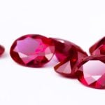 Bunch of Bright Red Rubies Lay on White Background