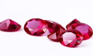 Bunch of Bright Red Rubies Lay on White Background