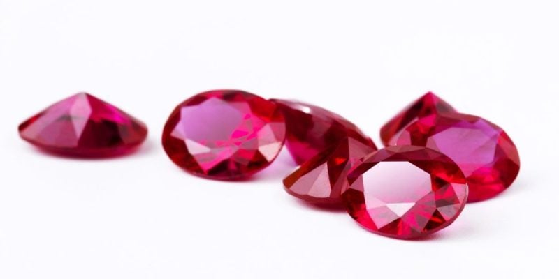 Bunch of Bright Red Rubies Lay on White Background