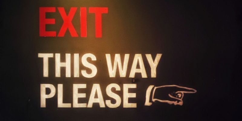 Red and White Exit Sign Reads 