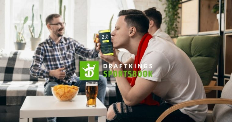 Friends Celebrate Sports Win, Man Kisses Cell Phone with DraftKings Logo