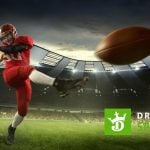 DraftKings Sportsbook Logo Over Image of American Football Player Kicking Football Inside Stadium