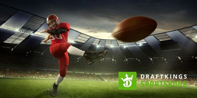 DraftKings Sportsbook Logo Over Image of American Football Player Kicking Football Inside Stadium