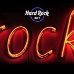 Hard Rock Bet Logo with Image of Glowing Neon Sign Reading 
