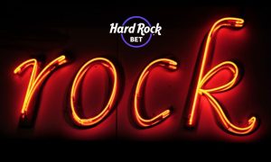 Hard Rock Bet Logo with Image of Glowing Neon Sign Reading "rock"