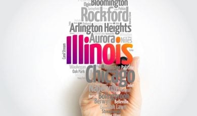 Man's Hand with Marker Points to Illinois Surrounded by Cities