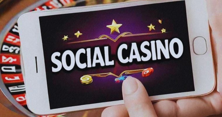 Close Up of Mobile Phone Reading "Social Casino" Held in Hand Sideways