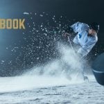 Caesars Sportsbook Logo Over Image of Hockey Player Hitting Puck While Spraying Ice Up