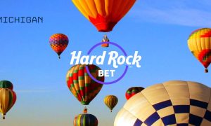 Hard Rock Bet Logo with "Michigan" Text Over Image of Various Colorful Floating Hot Air Balloons