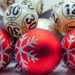 Lottery Balls Sit With Red Christmas Tree Balls