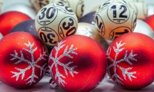 Lottery Balls Sit With Red Christmas Tree Balls