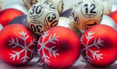 Lottery Balls Sit With Red Christmas Tree Balls