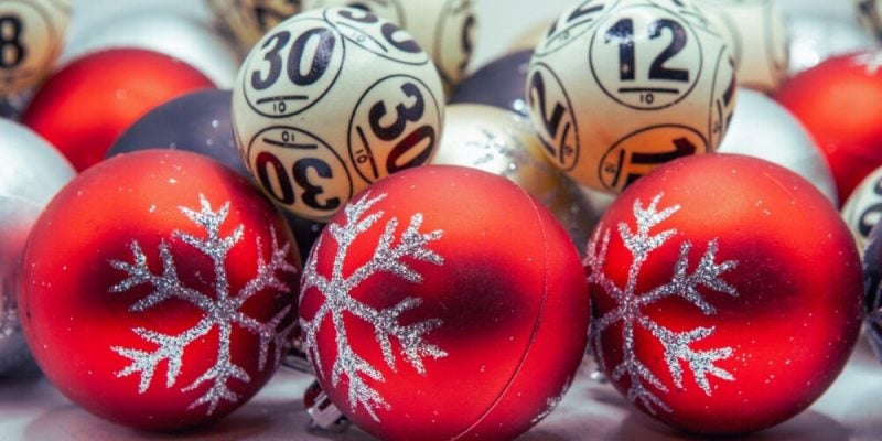 Lottery Balls Sit With Red Christmas Tree Balls