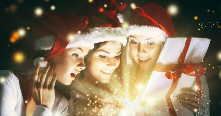 Christmas Gift Filled with Sparkling Light Opened by Three Young Ladies