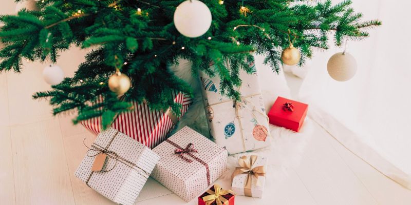 Bottom of Decorated Christmas Tree Displays Wrapped Gifts