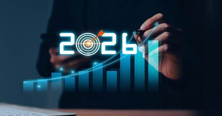 Blue Bar Chart with 2026 and Target at 0 Overlay on Image of Man Holding Cell Phone and Pen