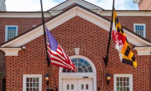 American and Stat4e Flags Hang at the Entrance of Senate Office Building in Maryland
