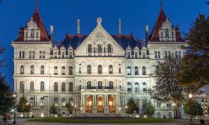 New York State Capitol Building Glows Against Blue Skies