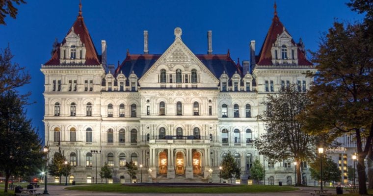 New York State Capitol Building Glows Against Blue Skies