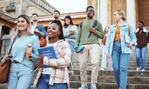 Group of Male and Female University Students Walk Down Campus Steps