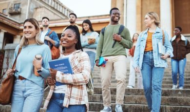 Group of Male and Female University Students Walk Down Campus Steps