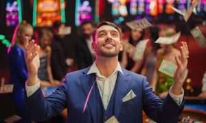 Money Falls From Sky Inside Casino As Young Man Looks Up
