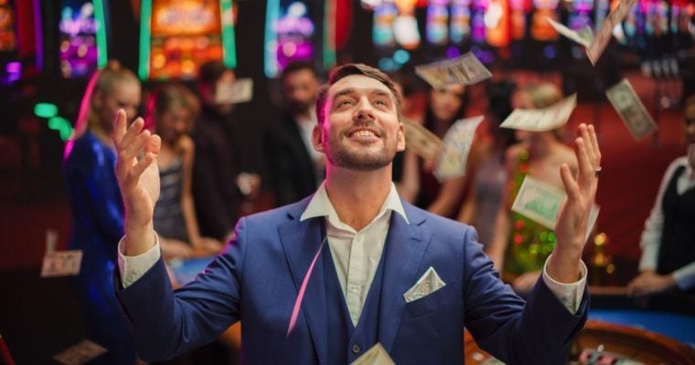 Money Falls From Sky Inside Casino As Young Man Looks Up