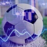 Blue Financial Line Graph Overlays Image of Soccer Ball on Green Grass