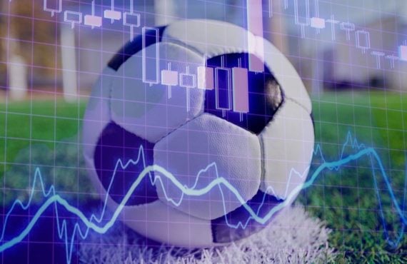 Blue Financial Line Graph Overlays Image of Soccer Ball on Green Grass