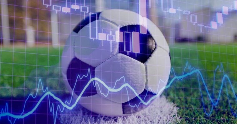 Blue Financial Line Graph Overlays Image of Soccer Ball on Green Grass