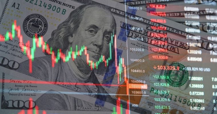 $100 Bills of US Currency with Overlay Image of Financial Graph Fluctuations