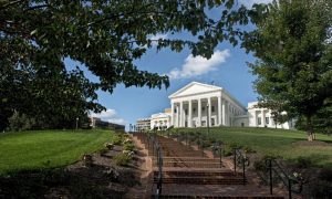 Blue Skies and Green-Leafed Trees Surround a While Capitol Building in VA