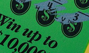 Green and Black Used Scratch Off Lottery Game