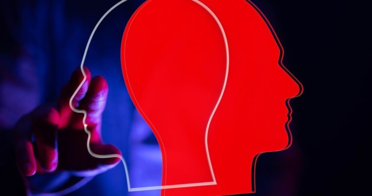 One Red and One Transparent Head Facing Opposite Directions Overlap with Man Touching