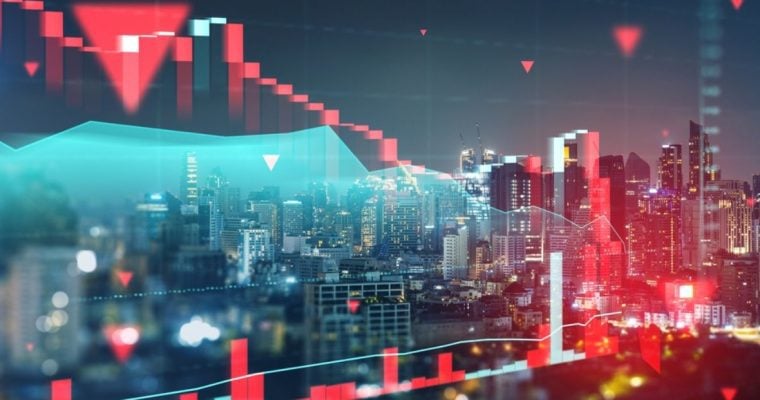 Cityscape at Night as Background with Red Financial Bar Graph Overlay