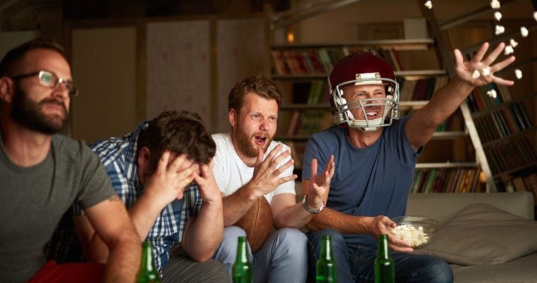 Men Watching American Football Display Varying Levels of Enthusiasm