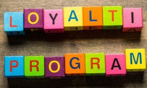 Text Loyalty Program Spelled Out on Colorful Wood Blocks
