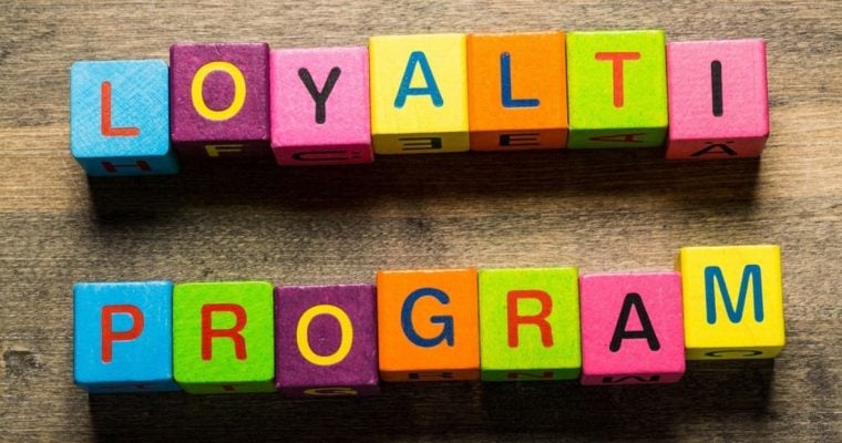 Text Loyalty Program Spelled Out on Colorful Wood Blocks
