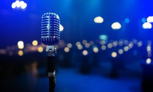 Blu-Lit Theater, Empty Seats and Vintage Stand-Up Microphone at Center