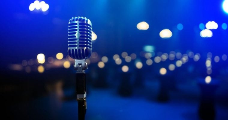 Blu-Lit Theater, Empty Seats and Vintage Stand-Up Microphone at Center