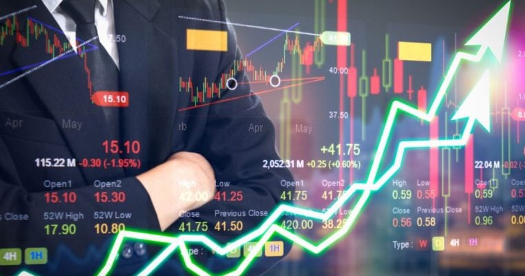 Business Man Stands with Folded Arms And Financial Market Graph and Green Arrow Overlay